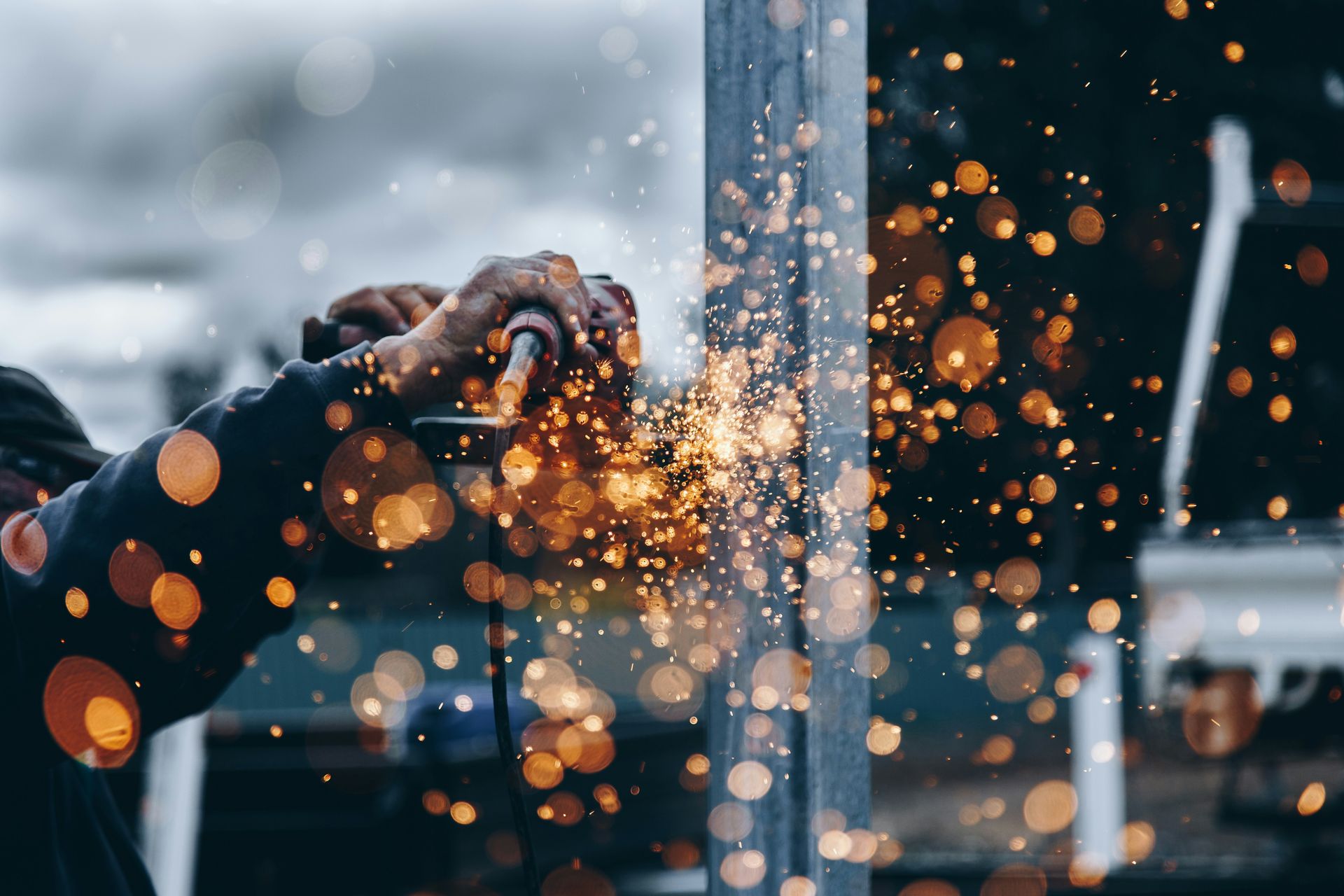 Welding sparks in an industrial workshop — industrial supplies sourcing partner Delhi NCR